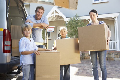 Packed boxes and furniture ready for local removals in Swiss Cottage