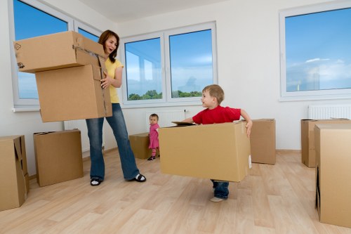 Packed moving boxes prepared for a Swiss Cottage removal van
