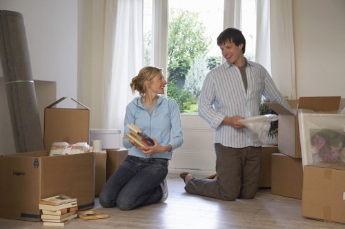 Moving van and removal crew managing a local residential move in Swiss Cottage