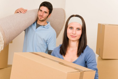 Packed boxes and furniture ready for urgent removals in Swiss Cottage