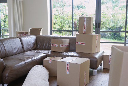 Removal van loading furniture and boxes for a student move in North West London