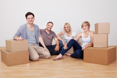 Movers handling furniture carefully during a same day relocation