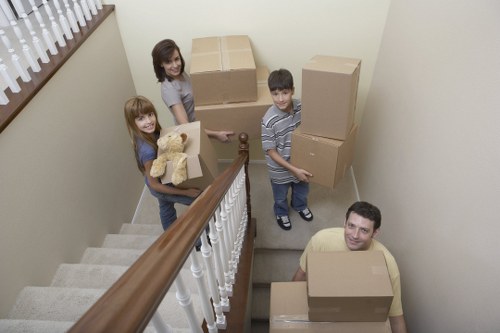 Professional movers handling boxes and furniture in Swiss Cottage